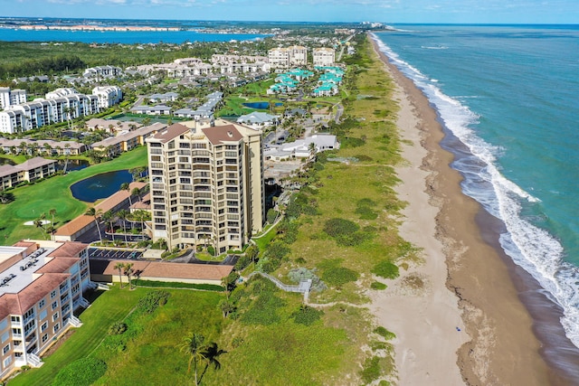 bird's eye view with a view of the beach and a water view