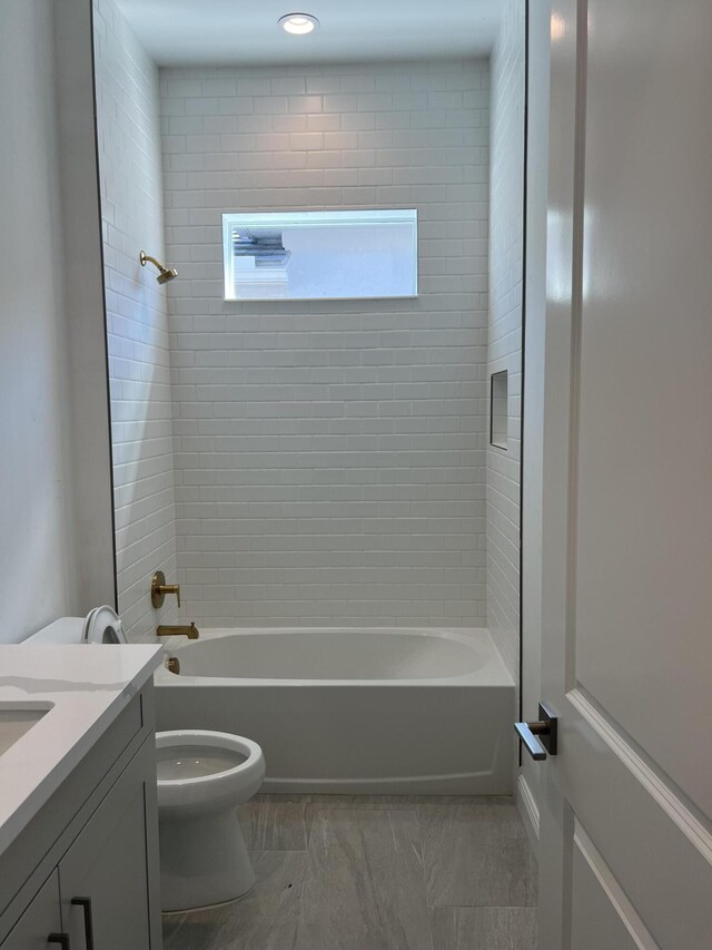 bathroom featuring vanity, toilet, and shower / bath combination