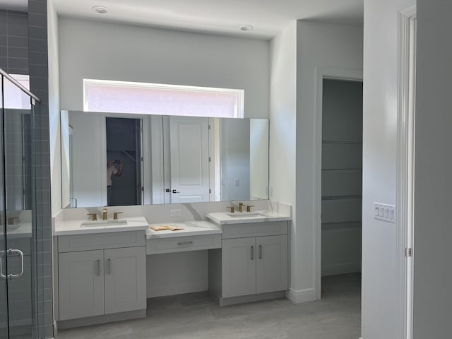 bathroom featuring vanity, plenty of natural light, and a stall shower