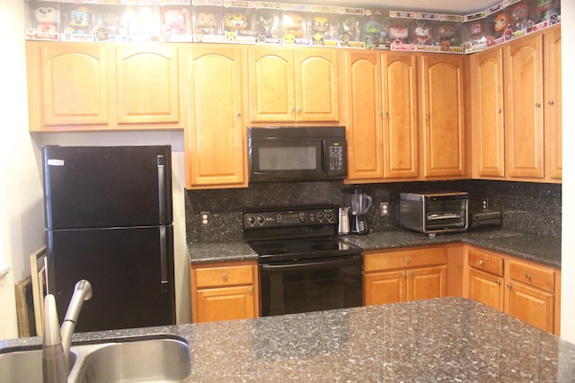 kitchen featuring decorative backsplash, sink, dark stone counters, and black appliances