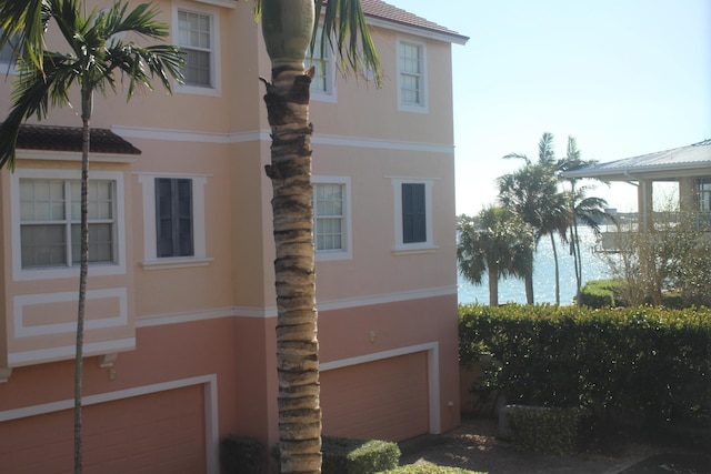 view of property exterior featuring a garage