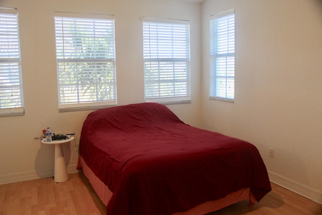 bedroom with light hardwood / wood-style floors