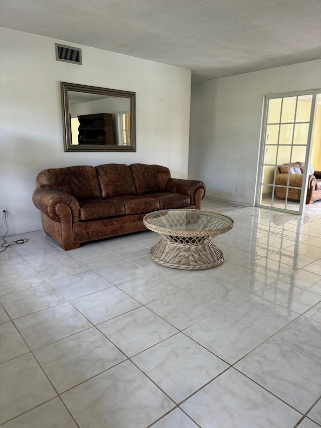 living room featuring a textured ceiling