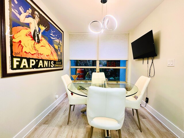 dining area with hardwood / wood-style flooring