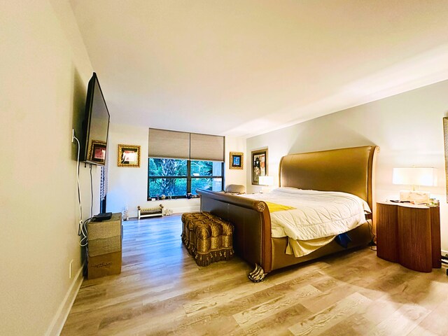 bedroom with wood-type flooring