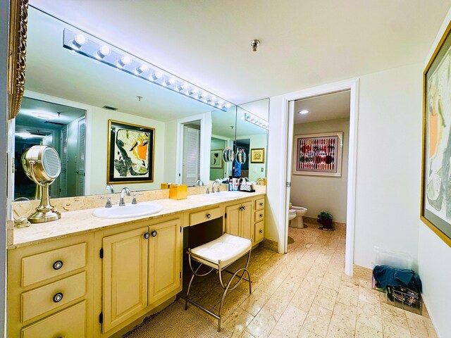 bathroom with vanity, an enclosed shower, and wood-type flooring