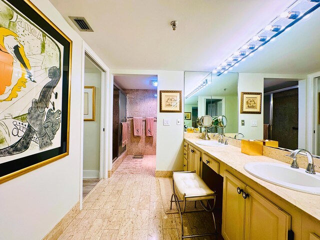 bathroom featuring vanity and walk in shower