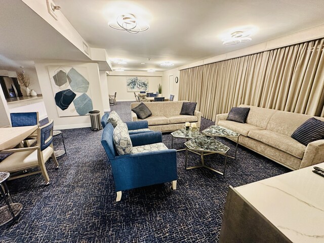 dining space featuring dark colored carpet