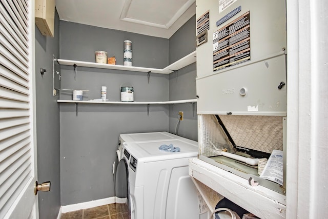 laundry room featuring tile patterned flooring and separate washer and dryer