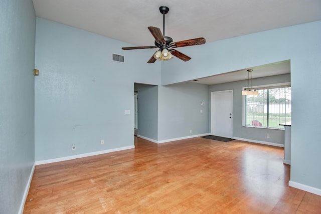 unfurnished room featuring ceiling fan and hardwood / wood-style flooring