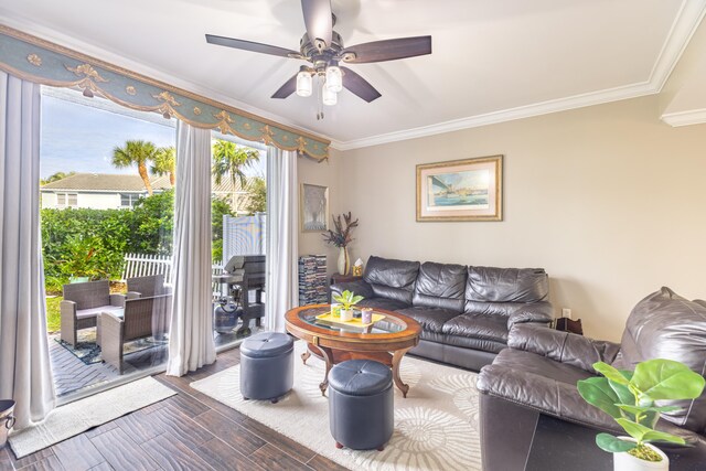 living room featuring crown molding, ceiling fan, and dark hardwood / wood-style floors