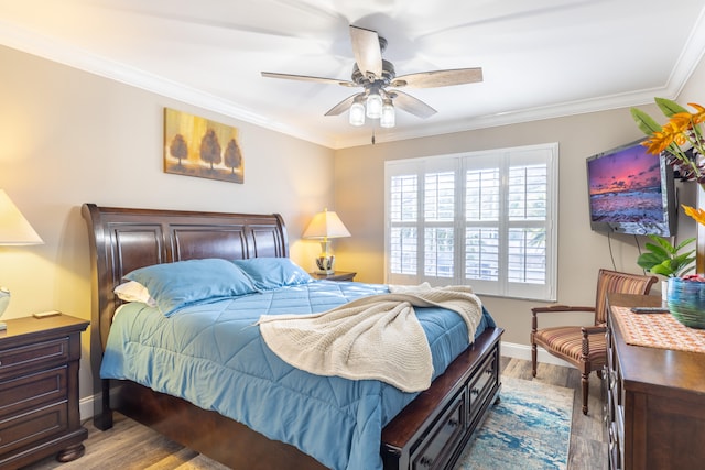 bedroom with ceiling fan, light wood-type flooring, and ornamental molding