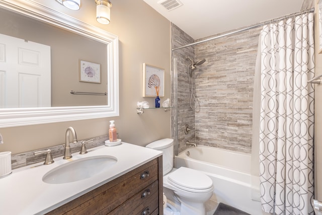 full bathroom featuring vanity, shower / bathtub combination with curtain, and toilet