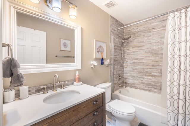 full bathroom with shower / tub combo with curtain, vanity, and toilet