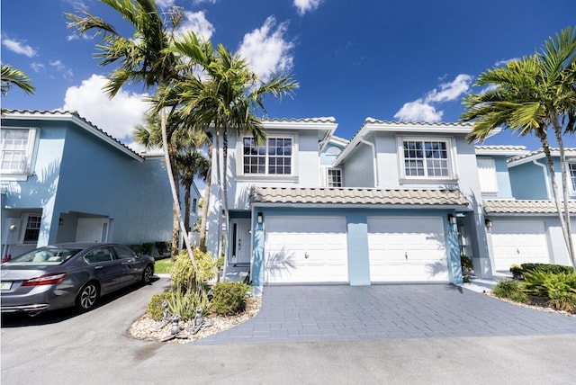 mediterranean / spanish-style house featuring a garage