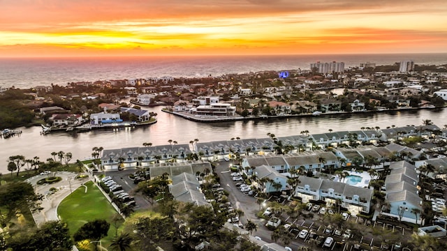 aerial view at dusk with a water view