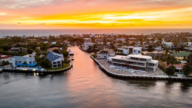 aerial view at dusk with a water view