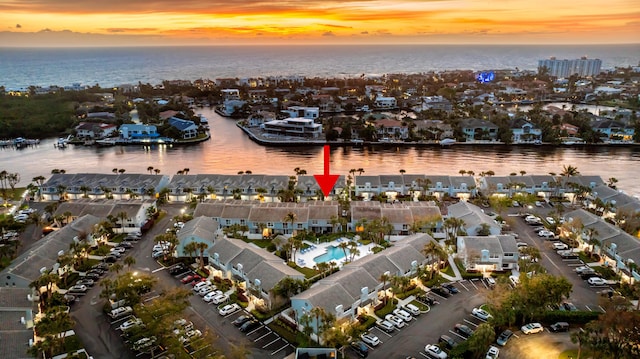 aerial view at dusk with a water view