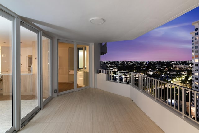 view of balcony at dusk