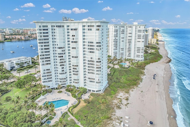 drone / aerial view featuring a view of the beach and a water view