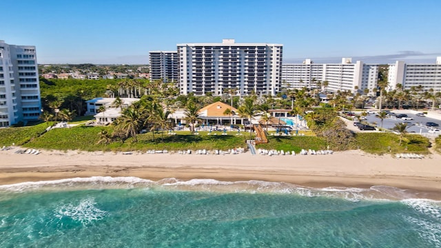 bird's eye view with a water view and a beach view