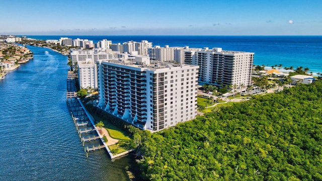 drone / aerial view featuring a view of city and a water view