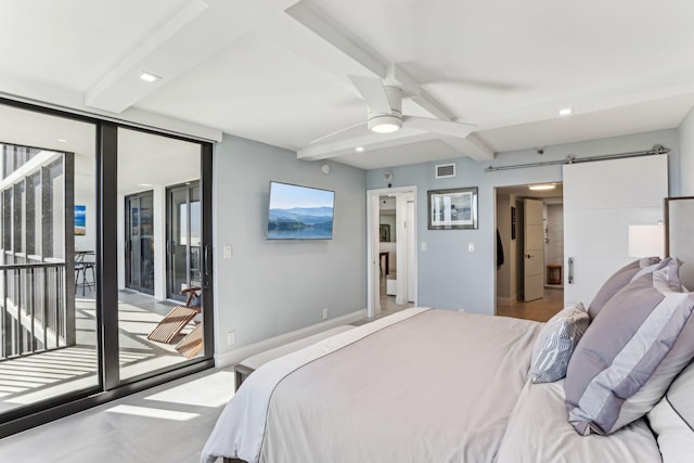 bedroom with beam ceiling, a barn door, access to outside, and a wall of windows