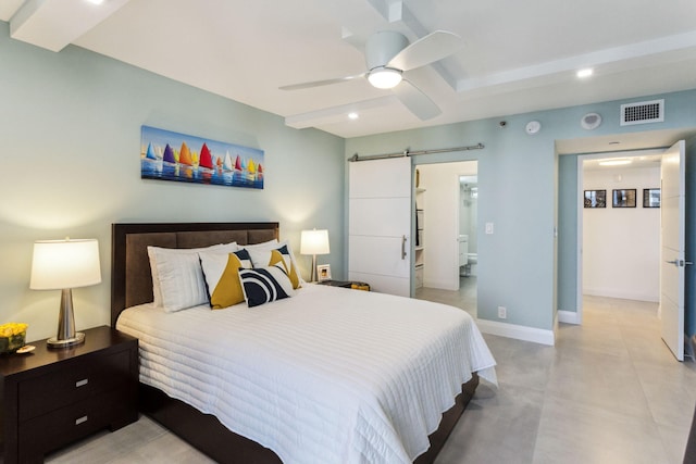 bedroom featuring beam ceiling, a barn door, and ceiling fan