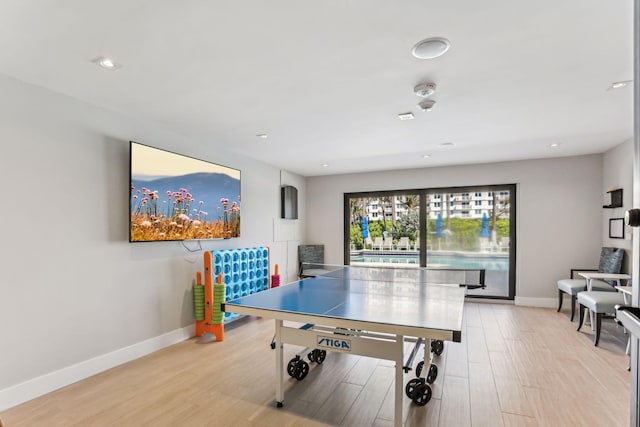 recreation room featuring light hardwood / wood-style floors