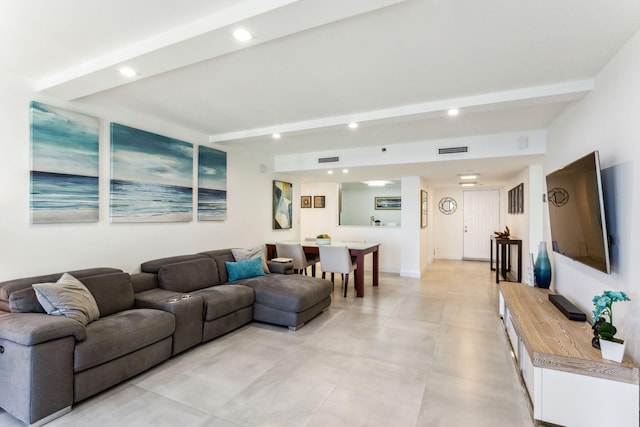 living room with beam ceiling