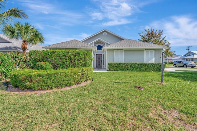 single story home featuring a front yard