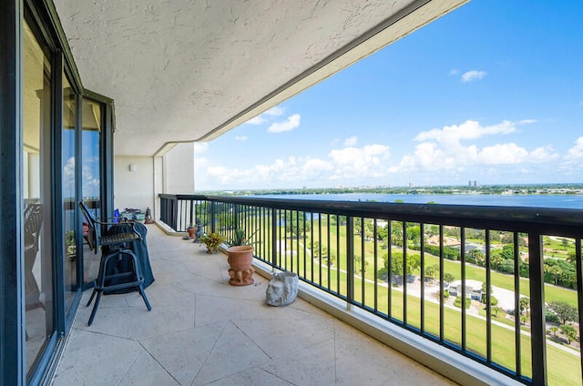 balcony featuring a water view