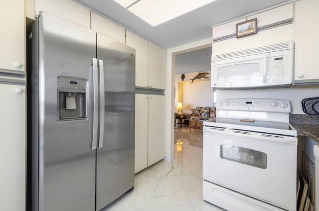 1900 Consulate Pl Unit 1702, West Palm Beach, FL 33401 - kitchen featuring white appliances, light marble finish flooring, and dark countertops