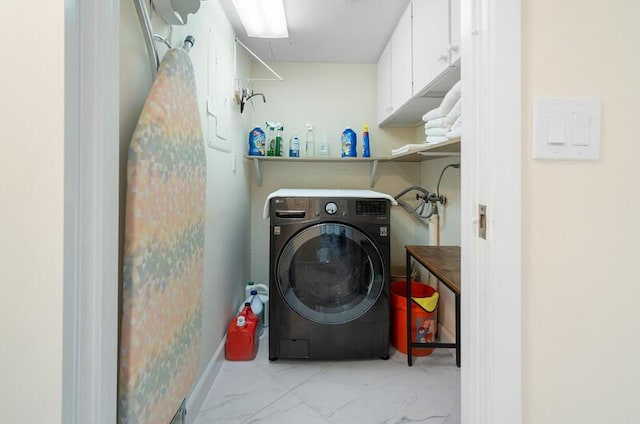 1900 Consulate Pl Unit 1702, West Palm Beach, FL 33401 - washroom with washer / dryer and marble look tiles
