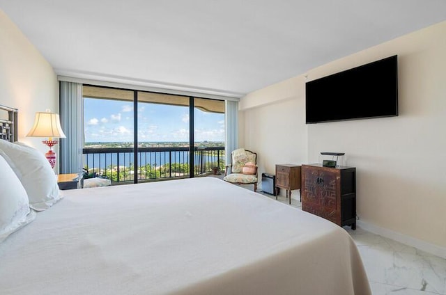 1900 Consulate Pl Unit 1702, West Palm Beach, FL 33401 - bedroom with expansive windows, access to exterior, marble finish floors, and baseboards