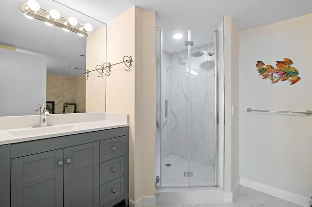 1900 Consulate Pl Unit 1702, West Palm Beach, FL 33401 - bathroom featuring marble look tile flooring, a marble finish shower, baseboards, and vanity