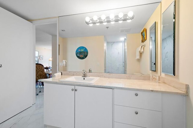 1900 Consulate Pl Unit 1702, West Palm Beach, FL 33401 - bathroom with marble finish flooring, vanity, and a shower