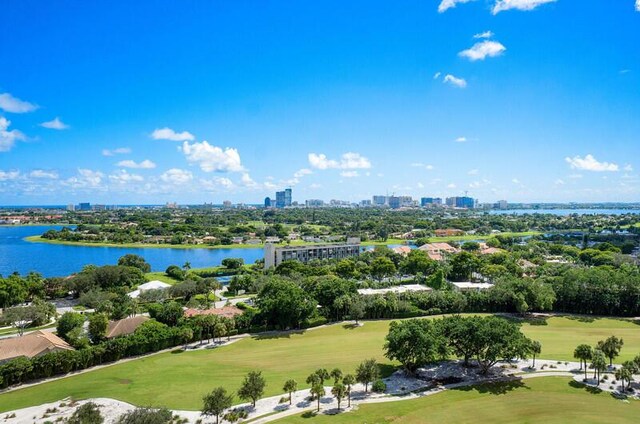 1900 Consulate Pl Unit 1702, West Palm Beach, FL 33401 - drone / aerial view of a skyline view, a nearby body of water, a golf course, and a tree filled landscape
