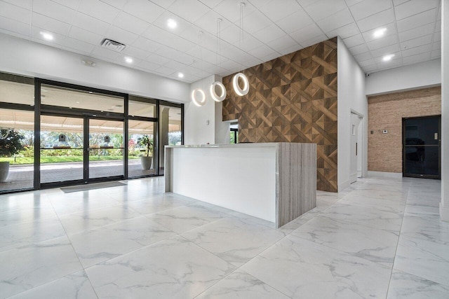1900 Consulate Pl Unit 1702, West Palm Beach, FL 33401 - welcome area featuring wooden walls and recessed lighting