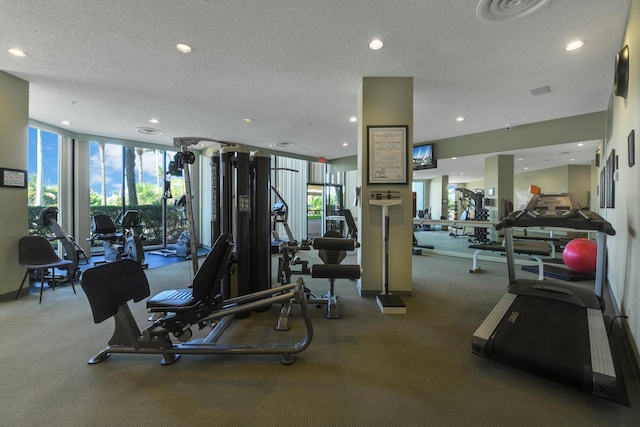 1900 Consulate Pl Unit 1702, West Palm Beach, FL 33401 - gym featuring healthy amount of natural light, carpet floors, a textured ceiling, expansive windows, and recessed lighting
