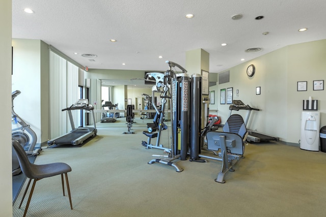 gym featuring a textured ceiling