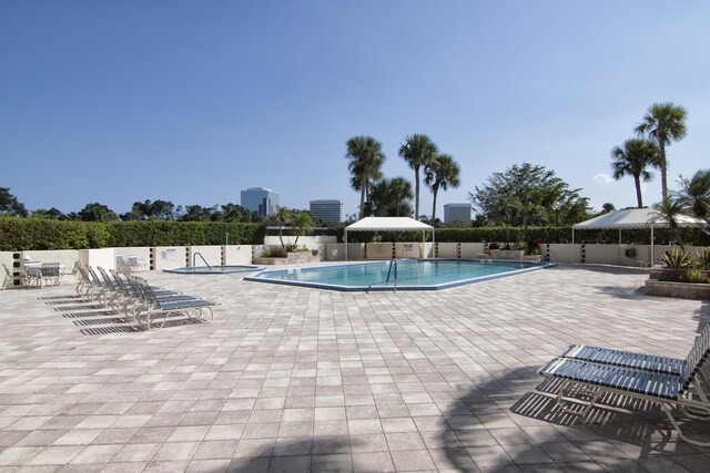 1900 Consulate Pl Unit 1702, West Palm Beach, FL 33401 - community pool featuring fence and a patio area