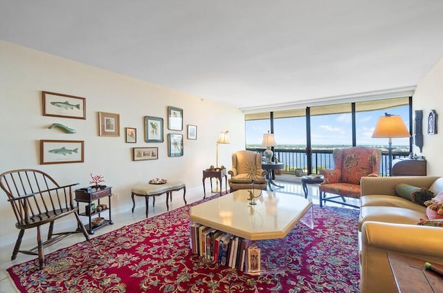1900 Consulate Pl Unit 1702, West Palm Beach, FL 33401 - living area with floor to ceiling windows, a water view, and baseboards