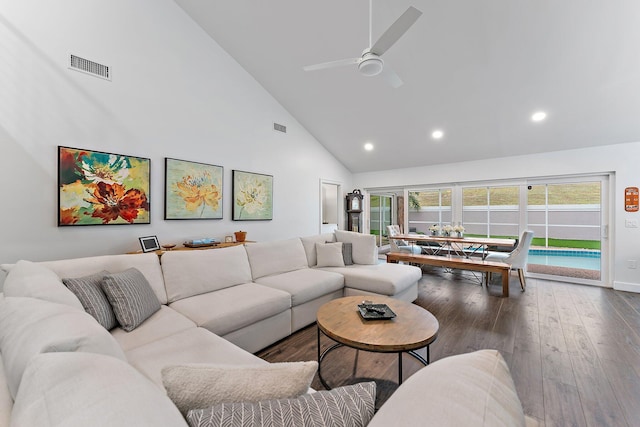 living room featuring hardwood / wood-style flooring, ceiling fan, and high vaulted ceiling