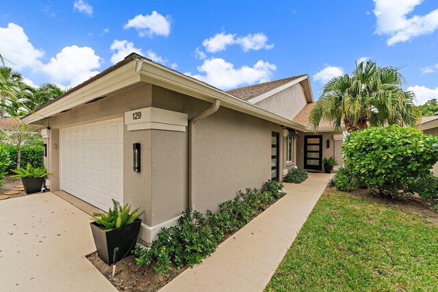 view of side of home featuring a garage