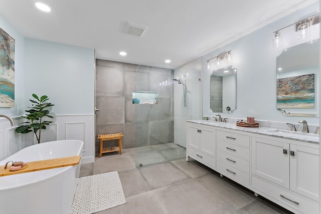 bathroom featuring vanity and separate shower and tub