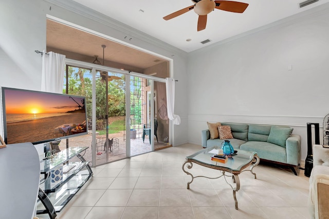 living room featuring ceiling fan, crown molding, and light tile patterned flooring