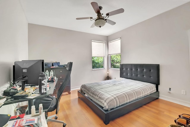 bedroom with ceiling fan and light wood-type flooring