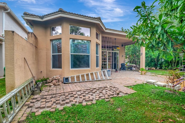 back of property with a patio area