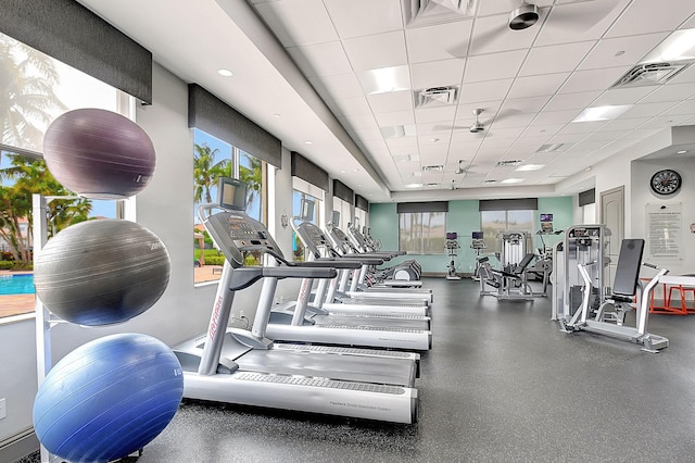 workout area featuring a paneled ceiling